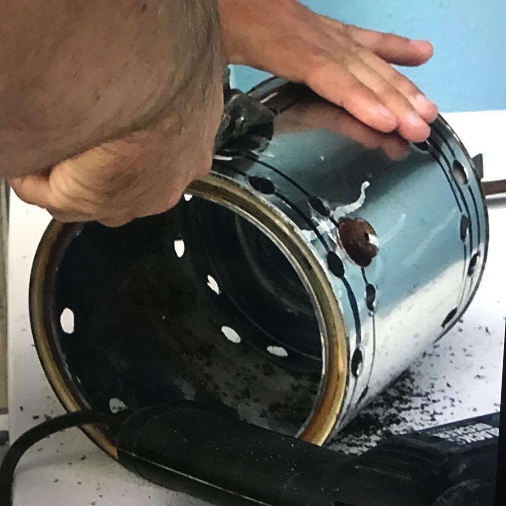 Using metal tin snips to cut an opening in a metal paint can